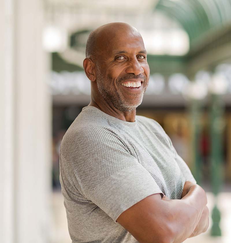 African American male in his 50's smiling