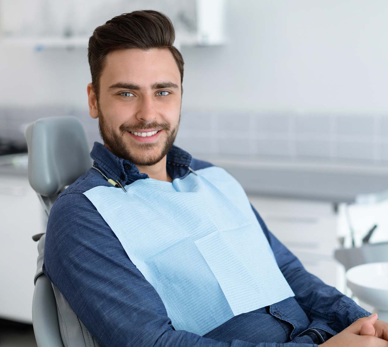 Male patient smiling at the dentist
