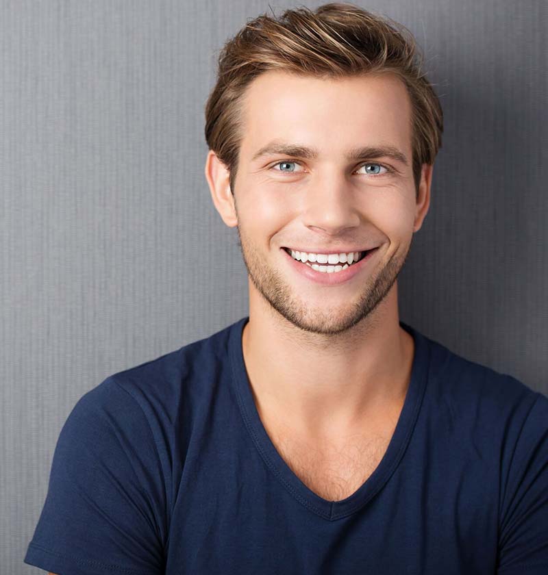 Young blonde male smiling