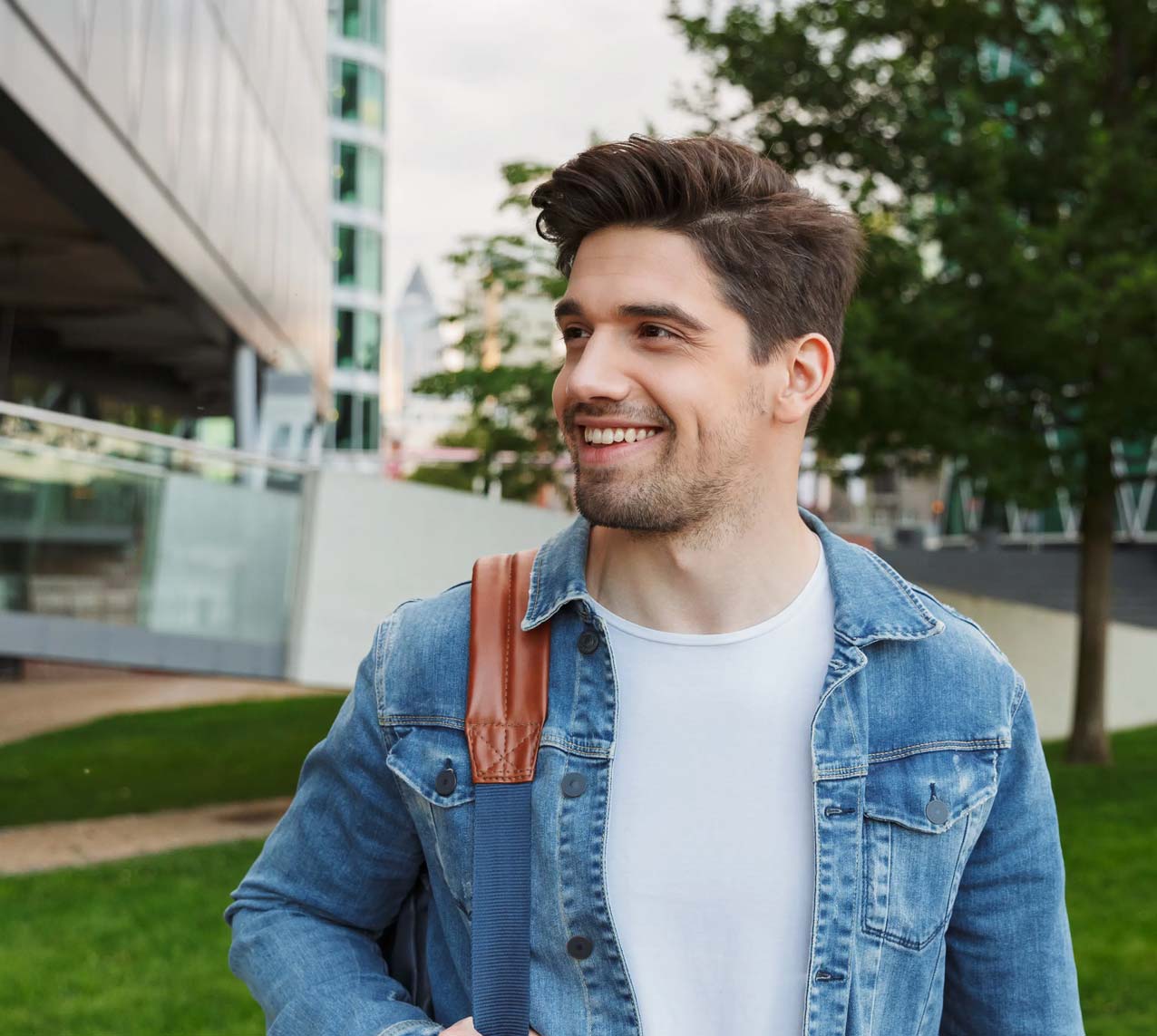 College student wearing backpack smiling