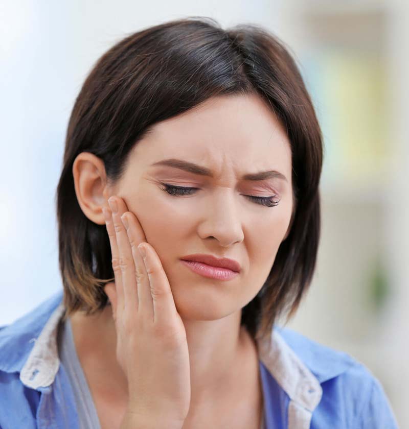 Woman experiencing tooth pain